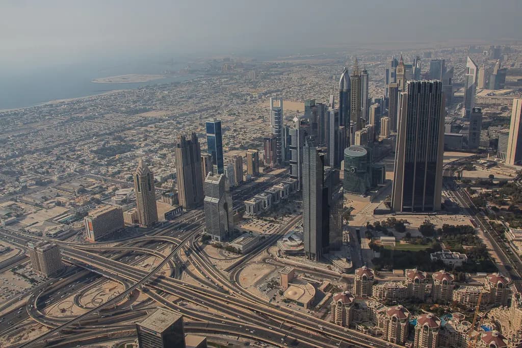 Aerial view of Dubai's financial district towers and the Sheikh Zayed Road interchanges