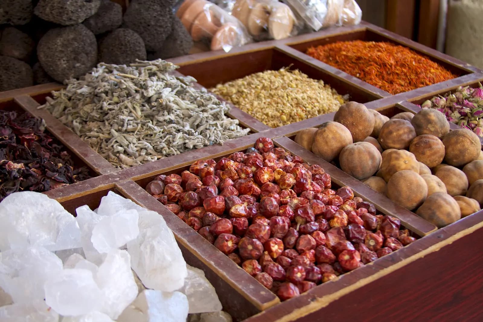 Trays of spices, dried flowers and dried limes on display in a shop in the Deira spice souk, Dubai