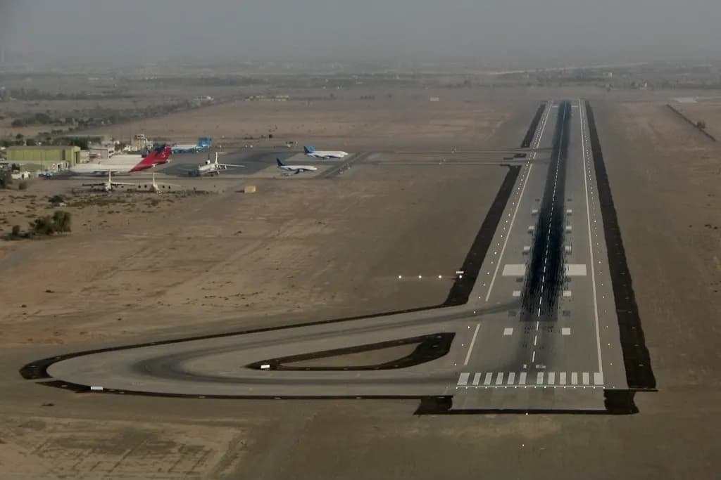 Aerial view of the runway and apron at Ras Al Khaimah International Airport on the desert plain