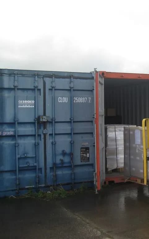 Open shipping container loaded with palletised goods