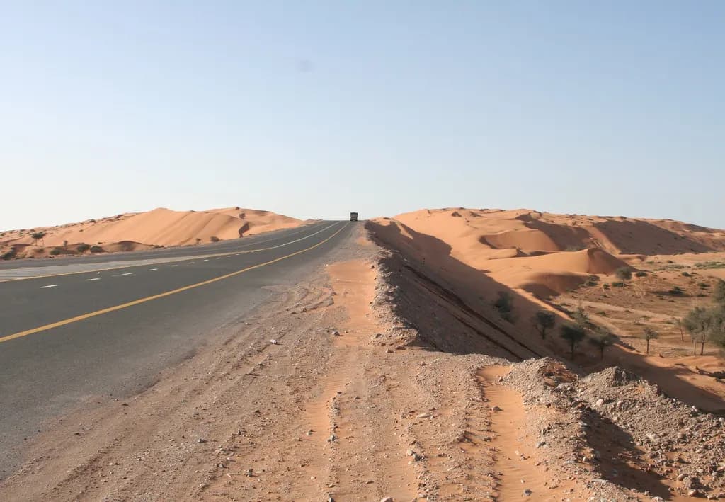The E311 Sheikh Mohammed bin Zayed Road running through desert dunes in the northern emirates