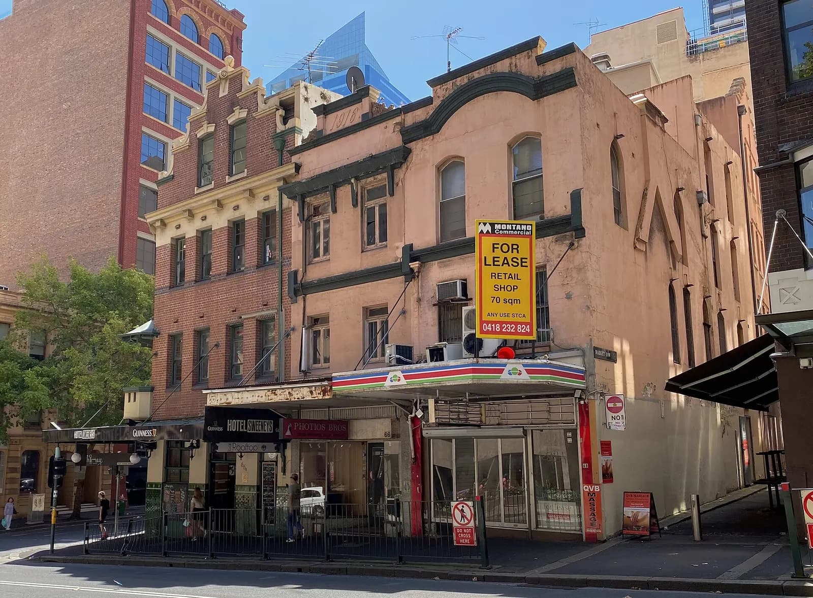 Heritage commercial buildings and office towers on Druitt Street in Sydney's central business district