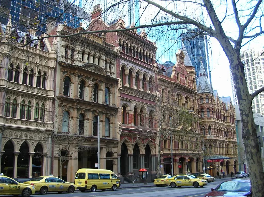Victorian-era buildings and taxis on Collins Street in Melbourne's CBD
