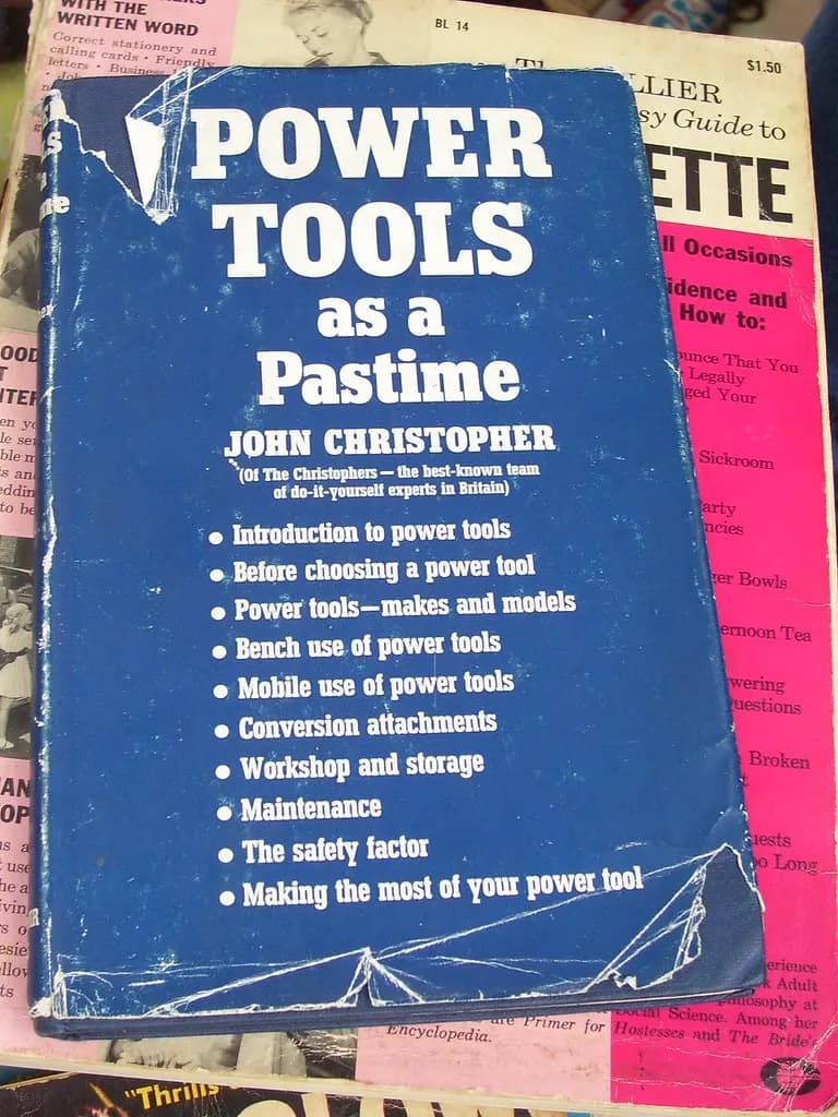 Power tools laid out on a workbench in a small Australian workshop