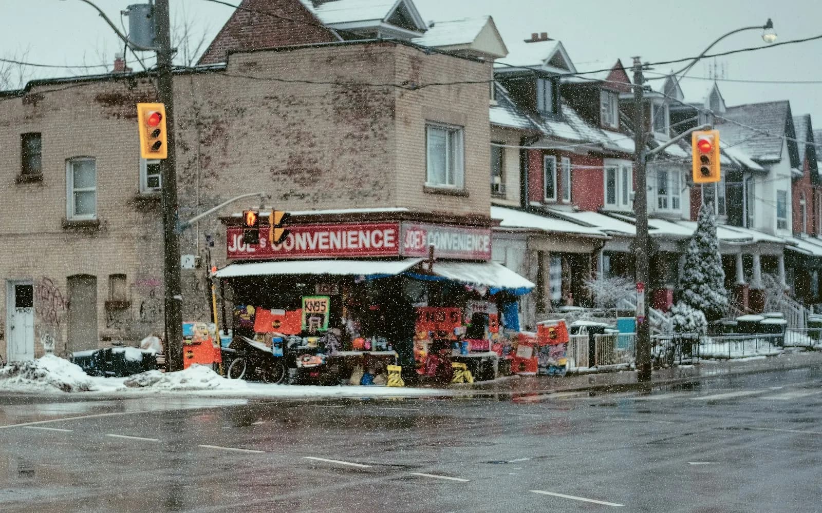Corner convenience store at Dupont Street and Ossington Avenue in Toronto on a snowy day