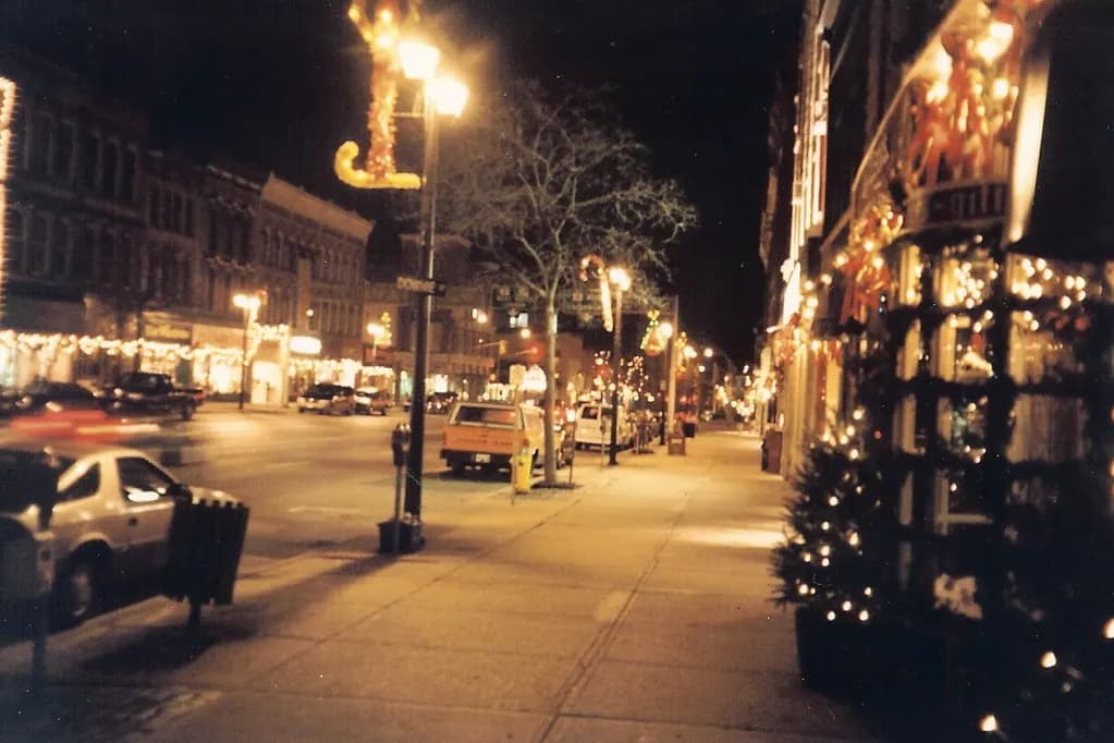 Downtown Stratford, Ontario, with a row of independent shops in historic brick buildings