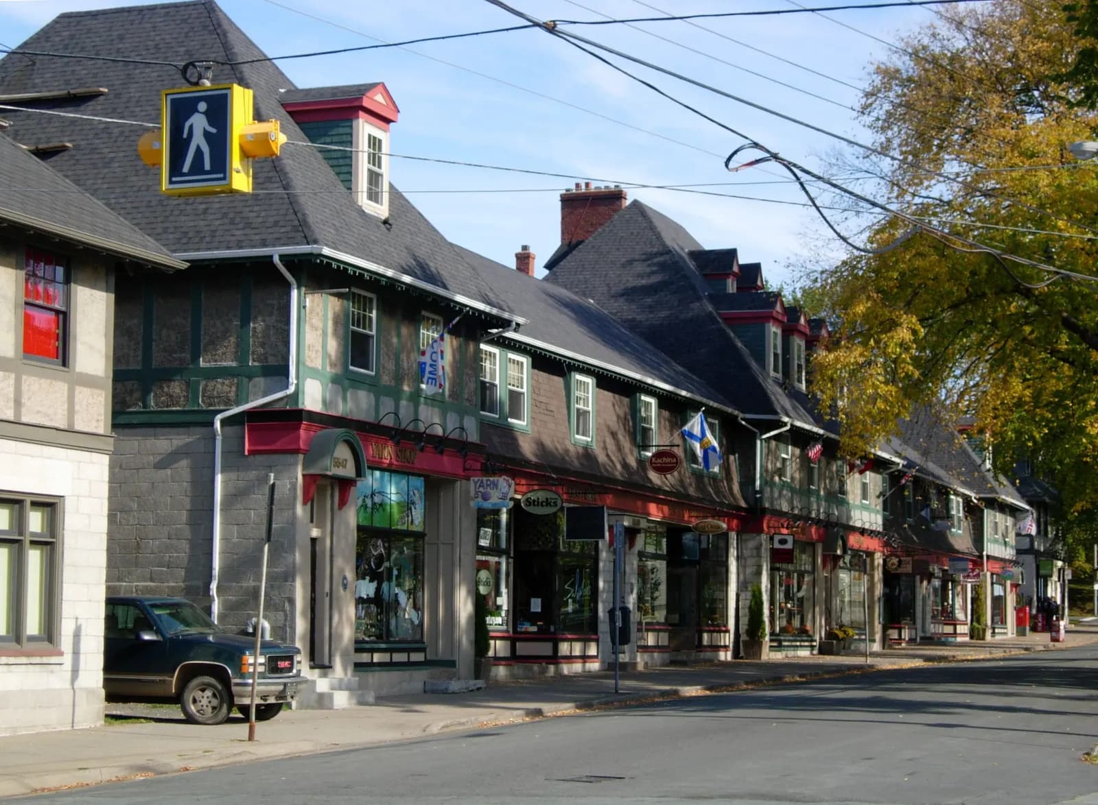 Row of small shops and cafés under awnings at the Hydrostone Market in Halifax's North End
