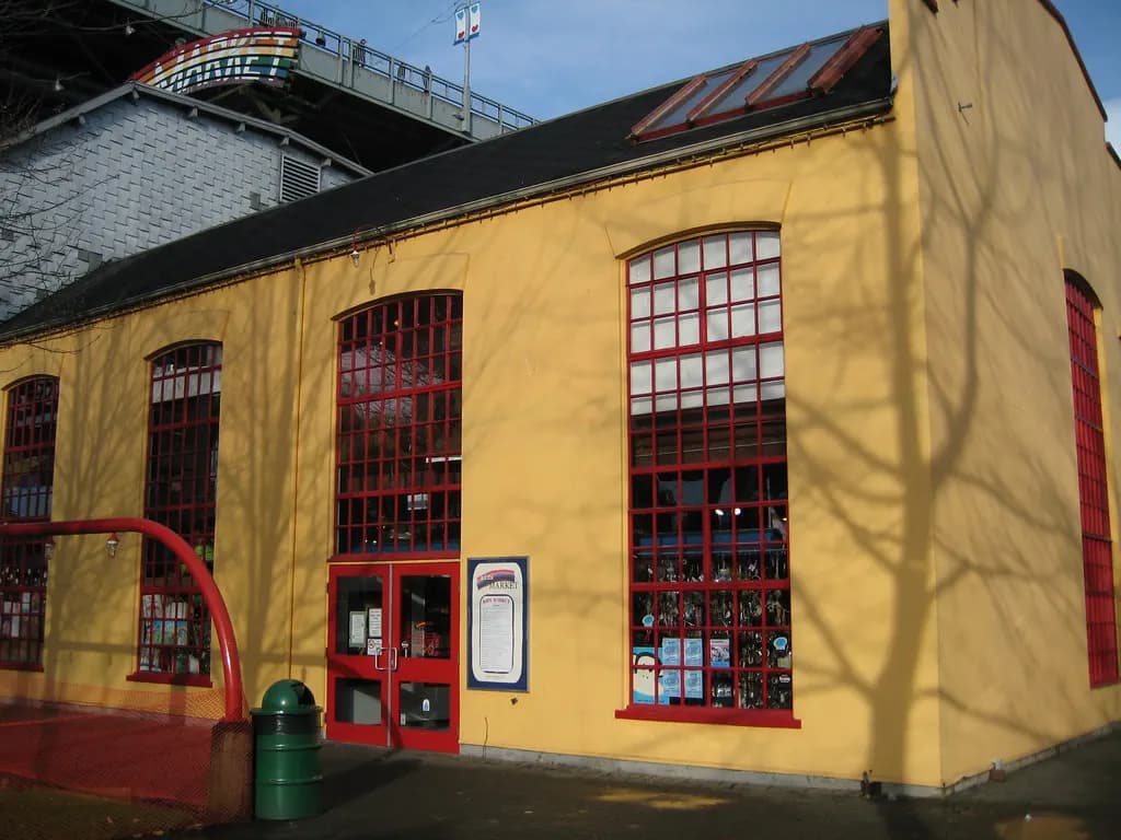 Small shop building with red-framed windows on Granville Island, Vancouver