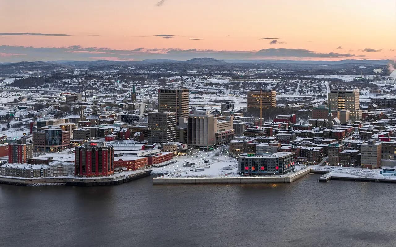 Aerial view of uptown Saint John, New Brunswick, in winter, with office towers along the harbour at sunset