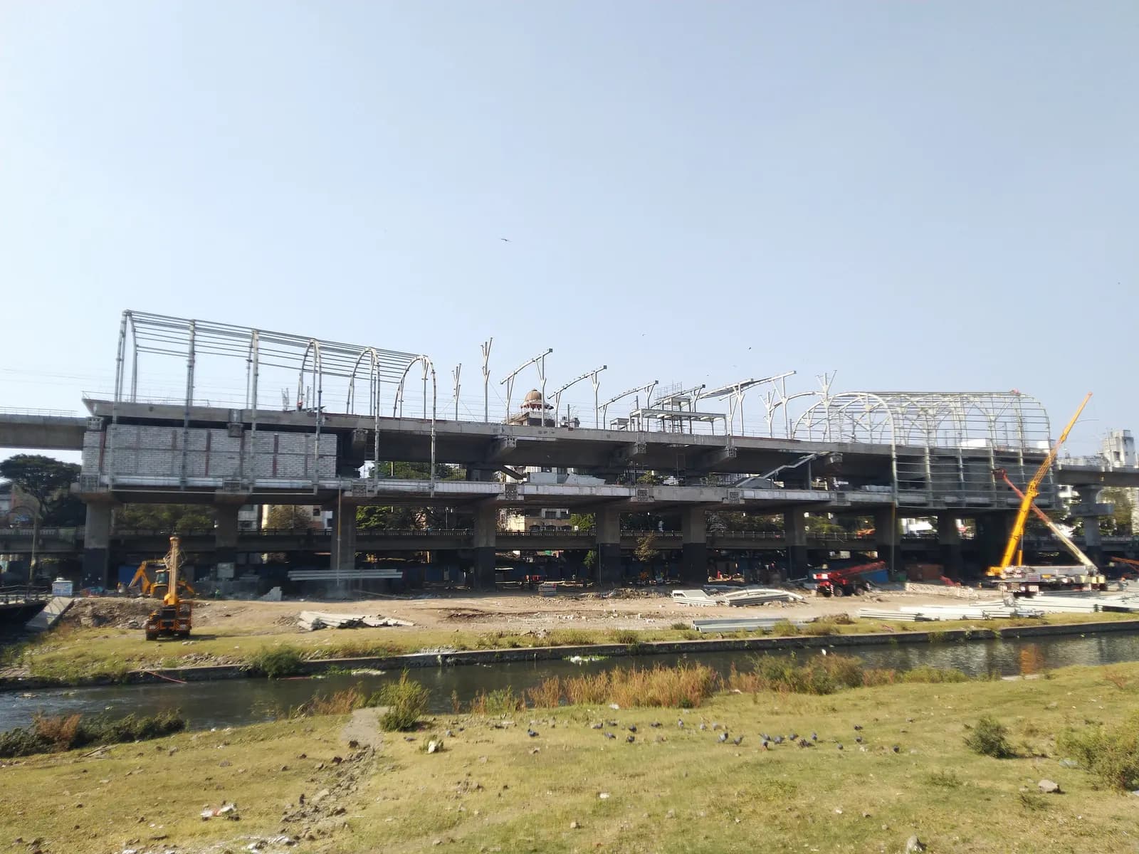 Deccan Gymkhana metro station in Pune under construction, with the steel roof frame going up on the elevated structure