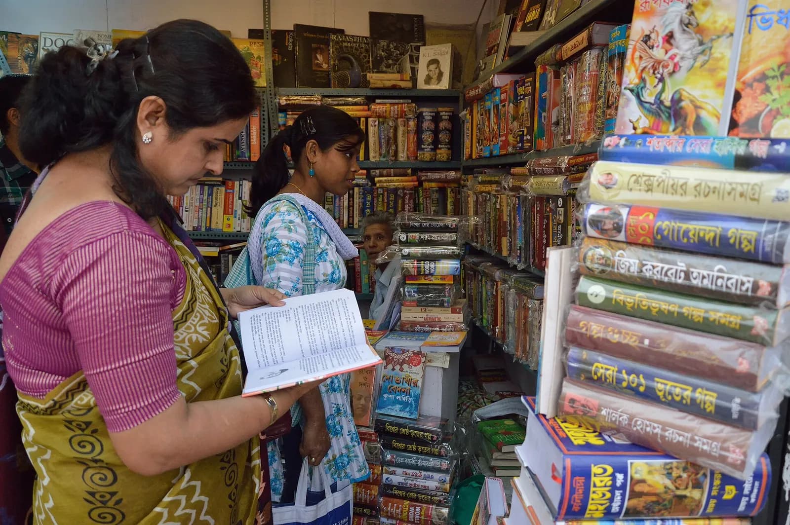 Readers browsing Bengali and English books at a stall at the International Kolkata Book Fair