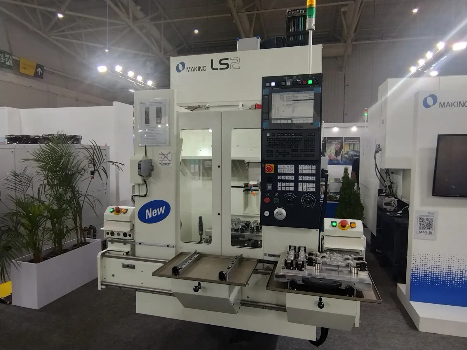 A CNC machining centre with its control panel on display at the IMTEX 2025 machine tool exhibition in Bengaluru