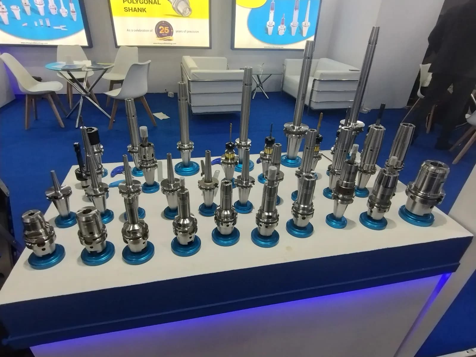 Rows of CNC tool holders and cutting tools displayed at IMTEX 2025 in Bengaluru