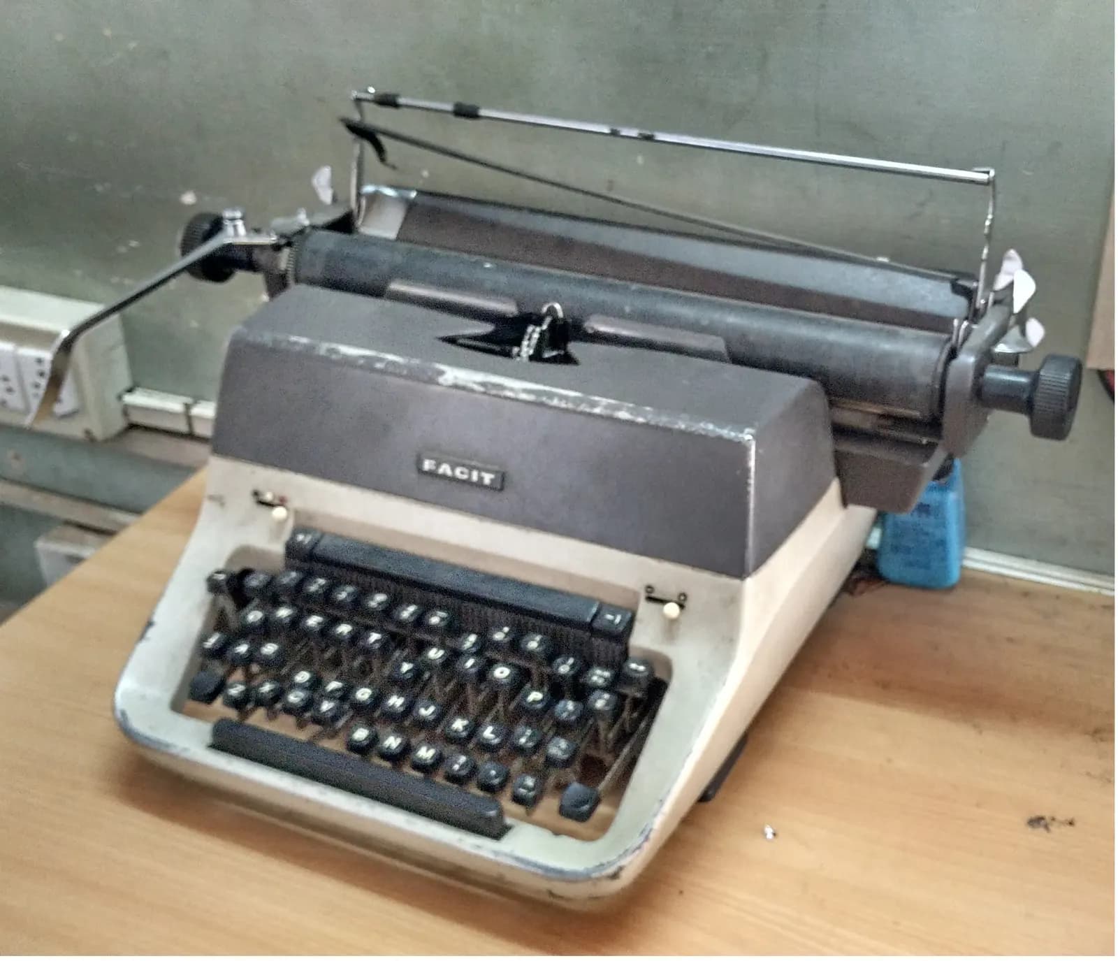 A manual typewriter with paper loaded