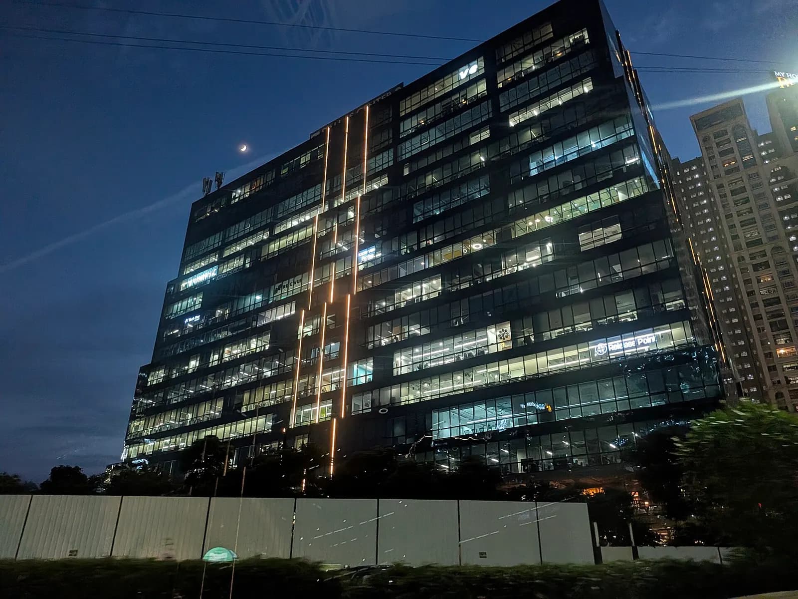Office tower in HITEC City, Hyderabad, with floors lit up in the evening