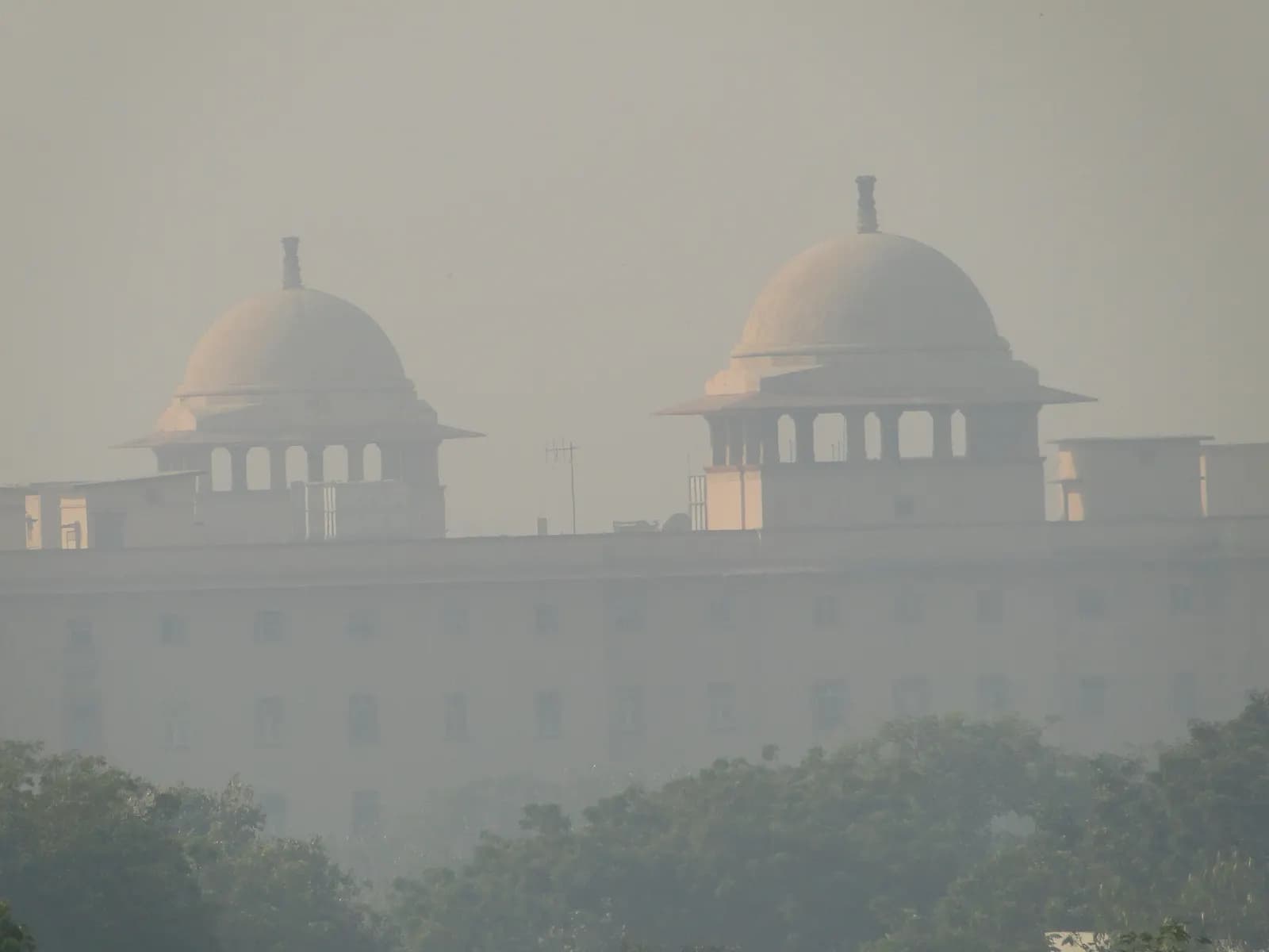 The domes of Krishi Bhawan, a central ministry building in New Delhi, in morning haze