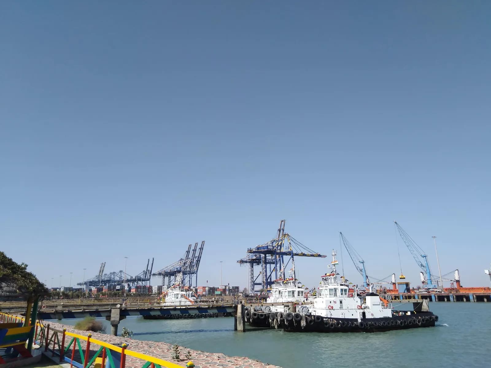Container cranes and harbour tugs at Mundra port in Kutch, Gujarat