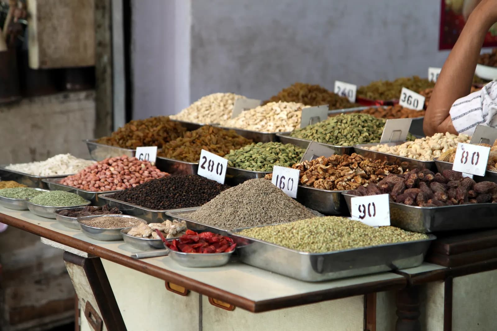 A spice shop at Khari Baoli, Old Delhi, with sacks and trays of whole spices on display