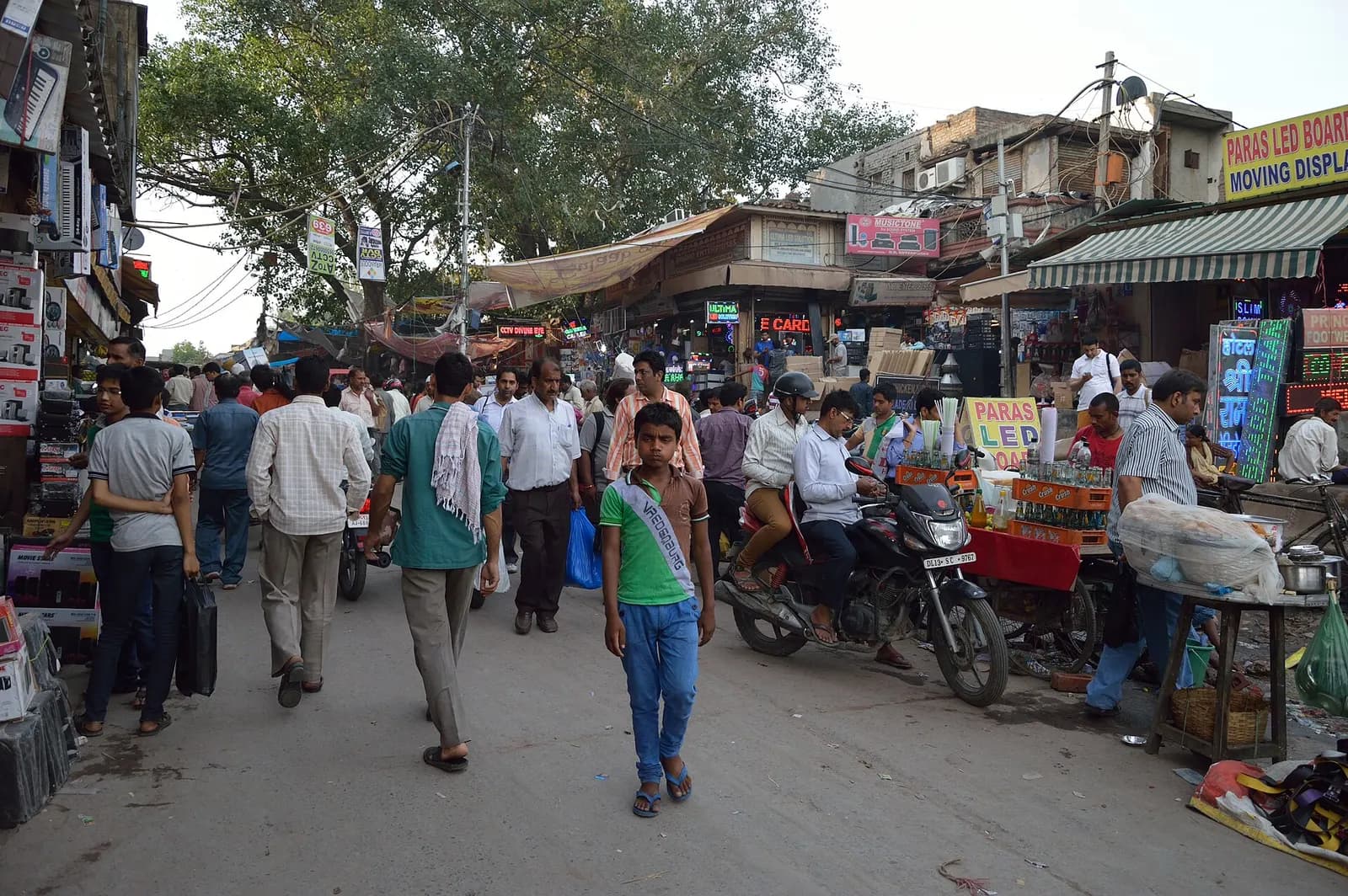 Shoppers and traders on a busy consumer electronics market street off Chandni Chowk, Delhi