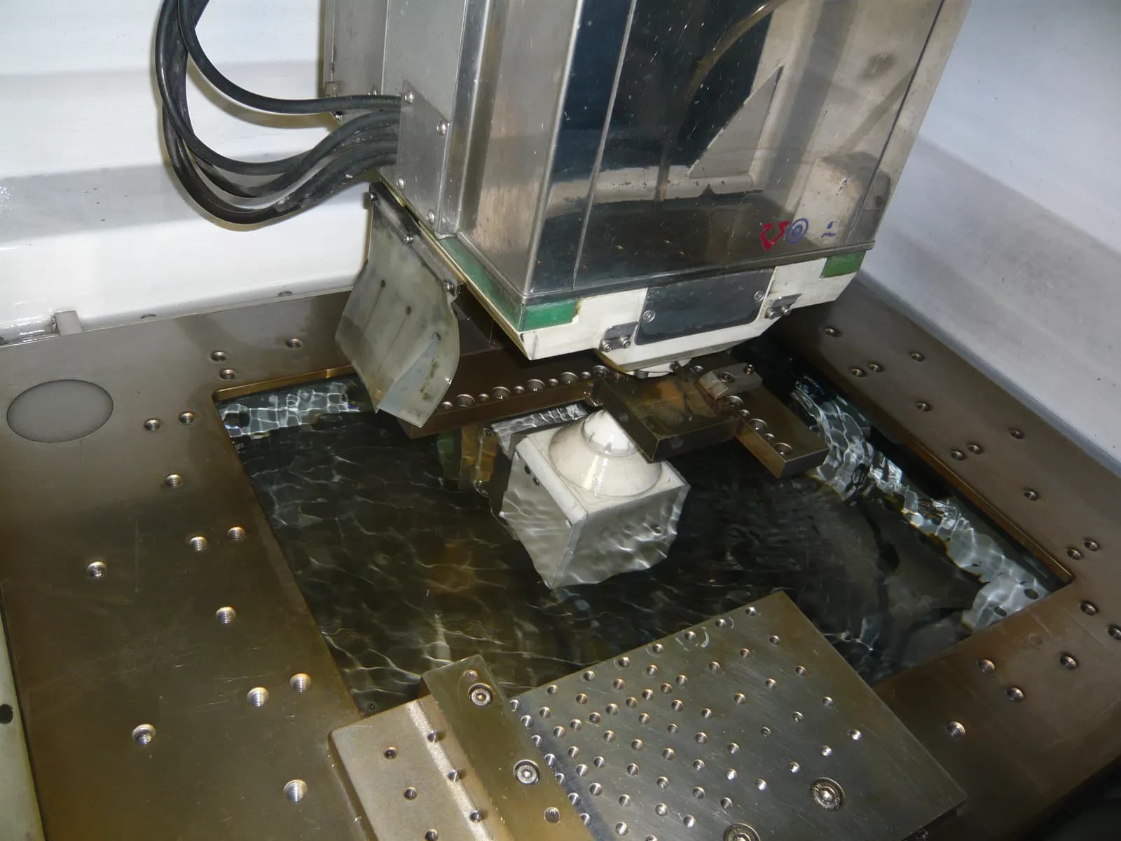 Electrical discharge machining (EDM) of a steel workpiece in a tool room