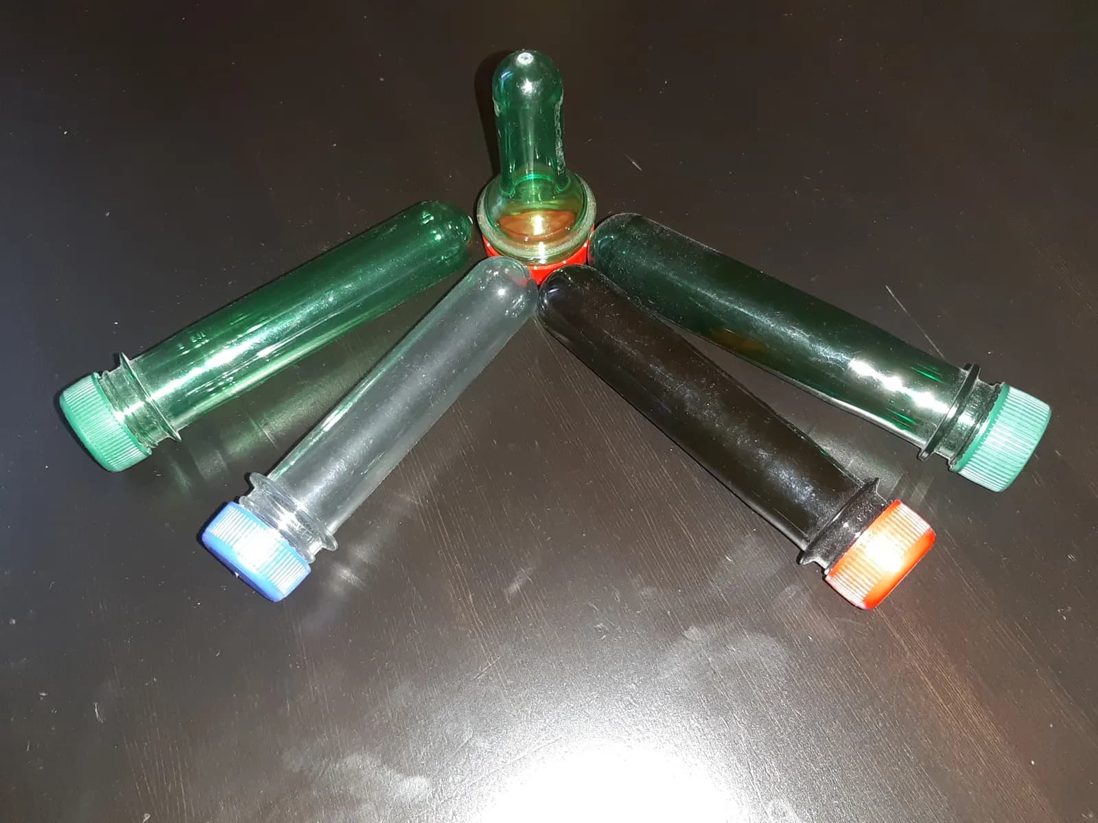 Clear PET preforms — the small test-tube-shaped plastic pieces that are blow-moulded into water bottles