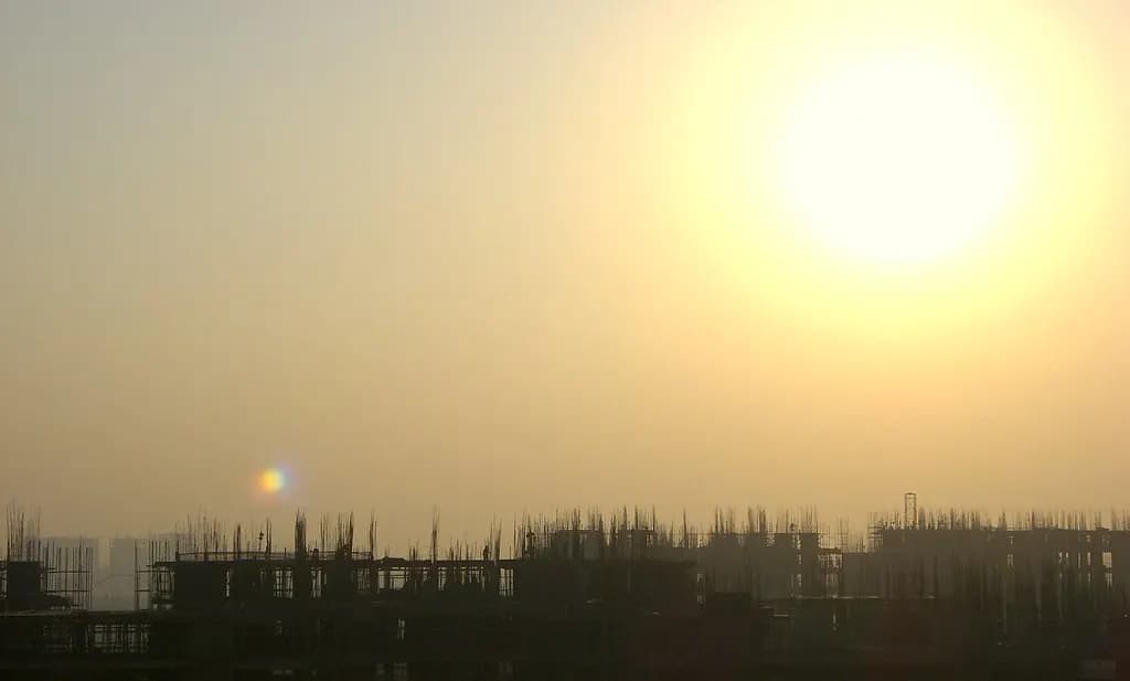 Concrete frames of buildings under construction at sunrise in Gurgaon, Haryana