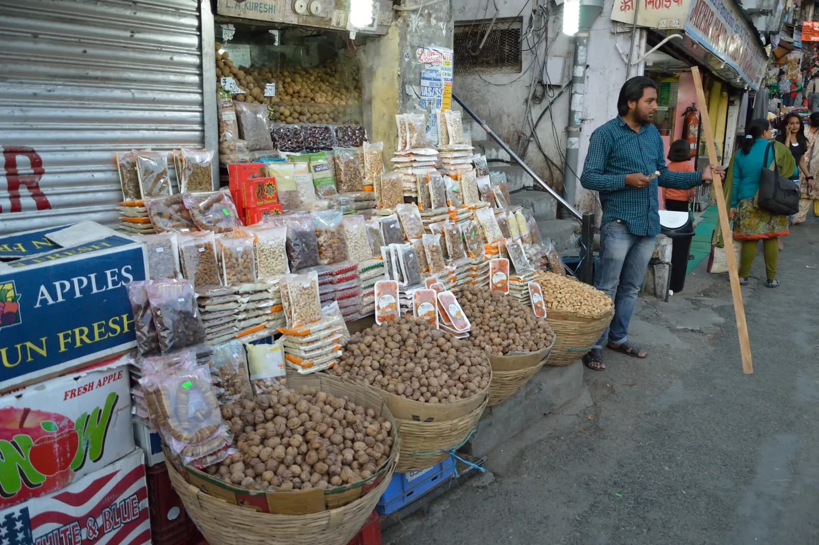 A dry-fruit shop in Lower Bazaar, Shimla, with goods stacked in sacks and jars