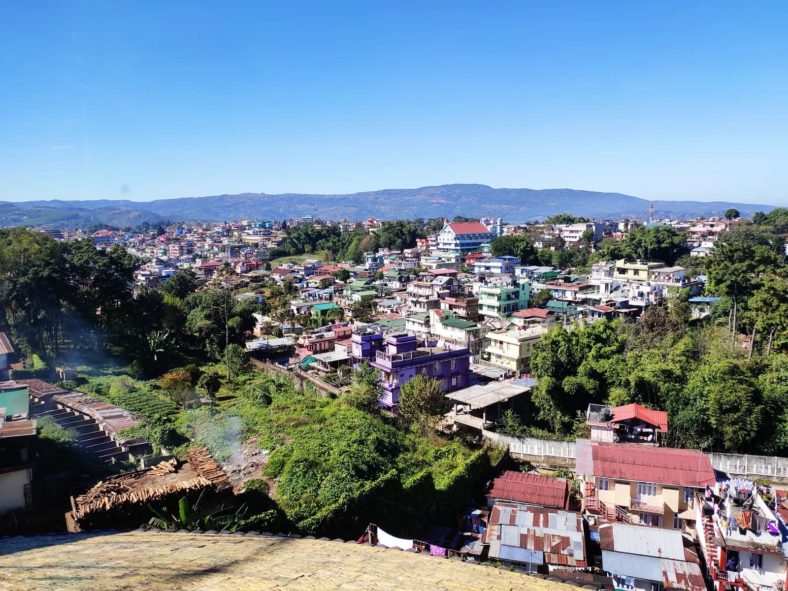 Houses and commercial buildings spread across the hills of Shillong, Meghalaya