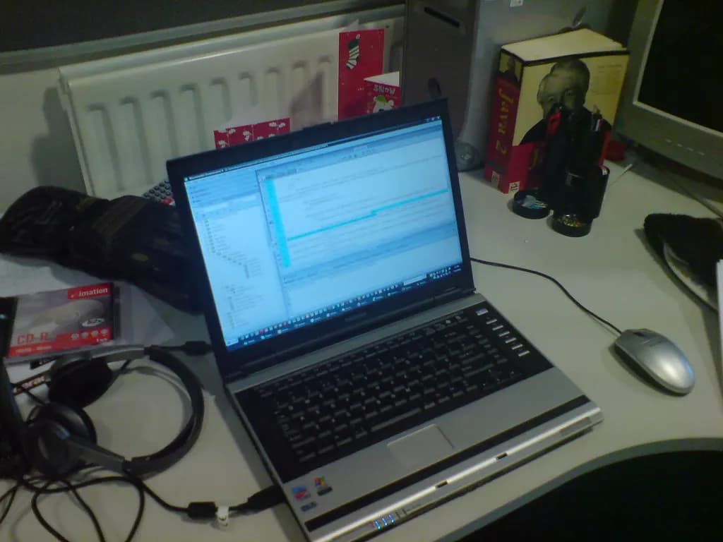 A laptop open on a work desk, the kind of setup used to apply for a loan online