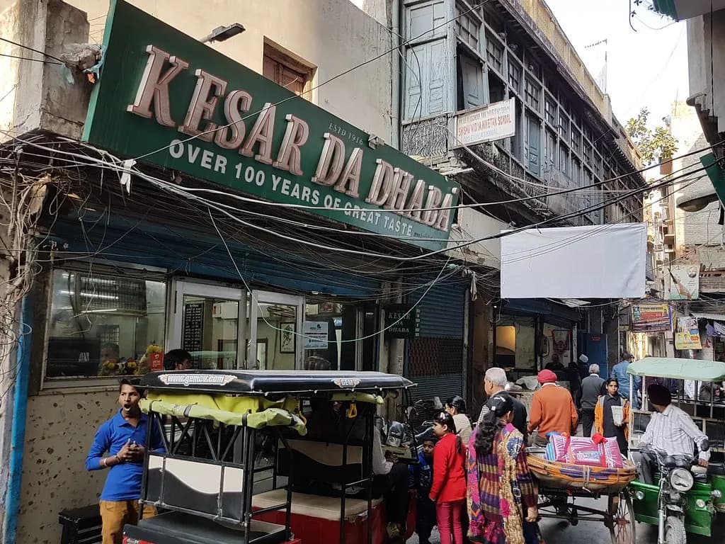The shopfront and signboard of Kesar da Dhaba, an eatery of over 100 years in Amritsar's old city
