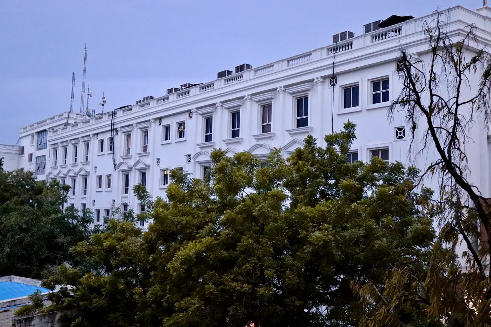 A multi-storey commercial complex with shops and offices on a main road in Begumpet, Hyderabad