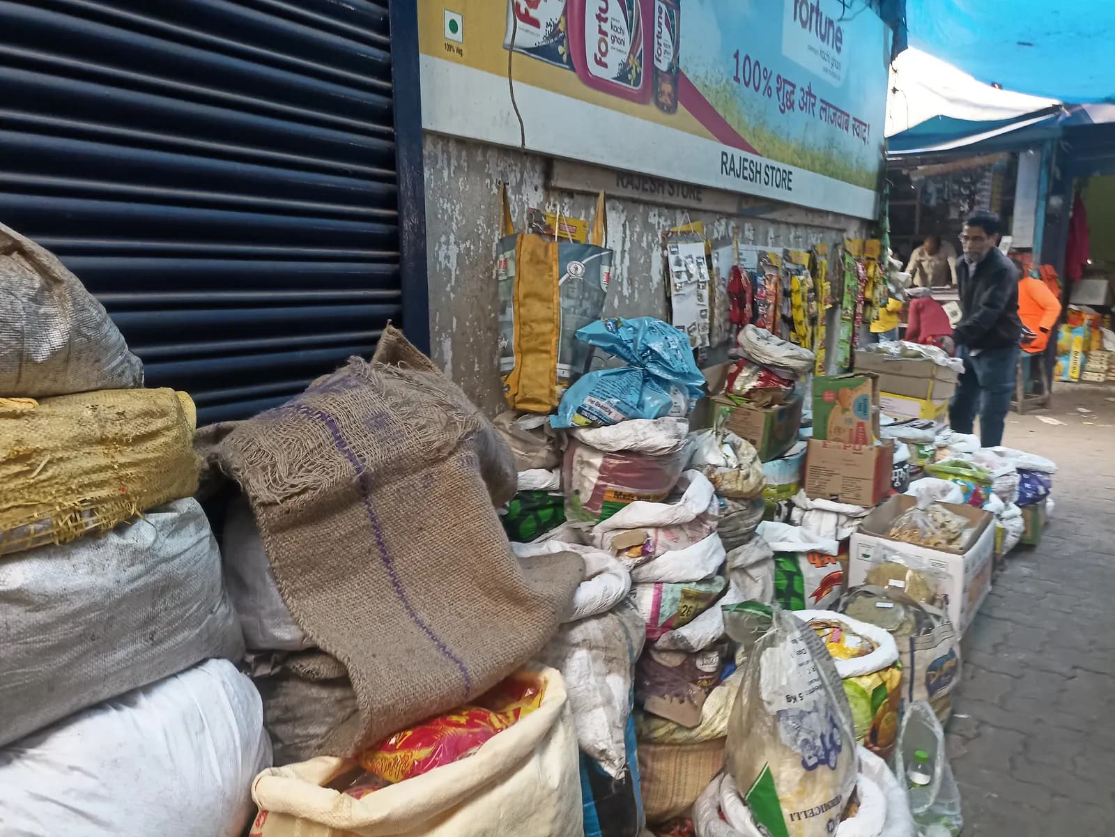 Sacks of grains, spices and packaged goods stacked outside a shop in Sakchi main market, Jamshedpur