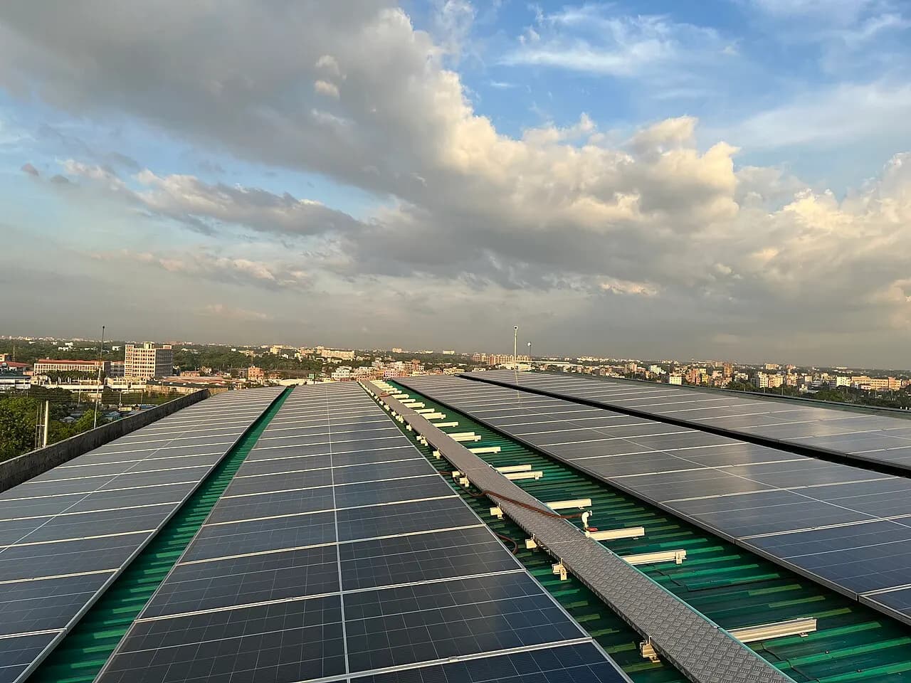 Rows of solar panels installed on the roof of an industrial building