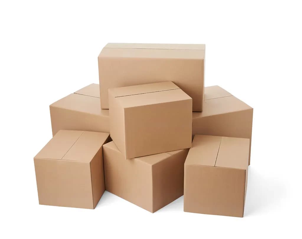 A stack of plain brown corrugated shipping boxes ready for dispatch
