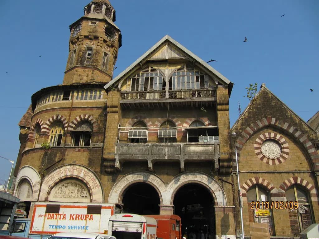 Mahatma Jyotiba Phule (Crawford) Market building in Mumbai with goods tempos parked outside