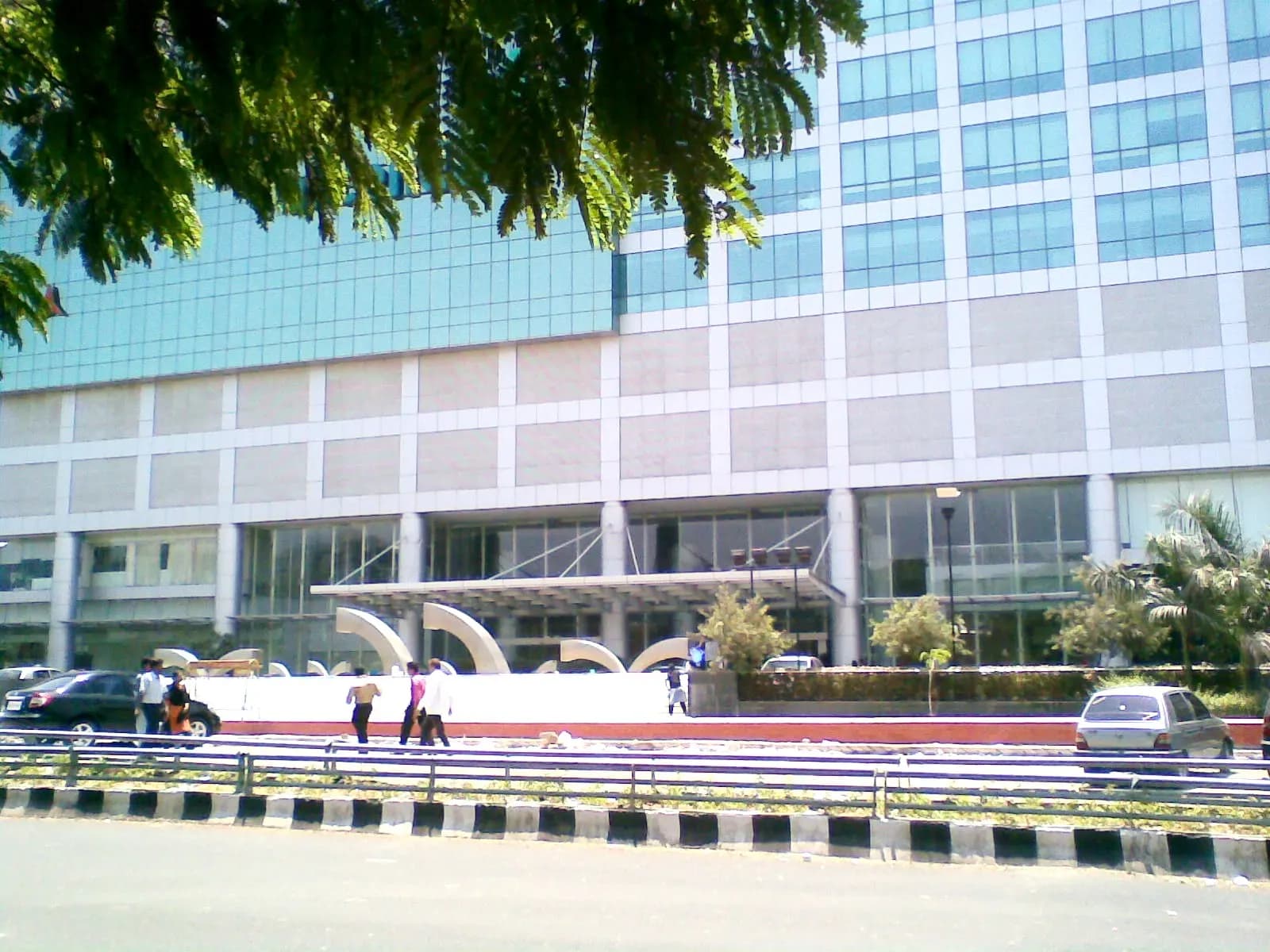 Glass-fronted office towers of an IT park on a Chennai road at Taramani