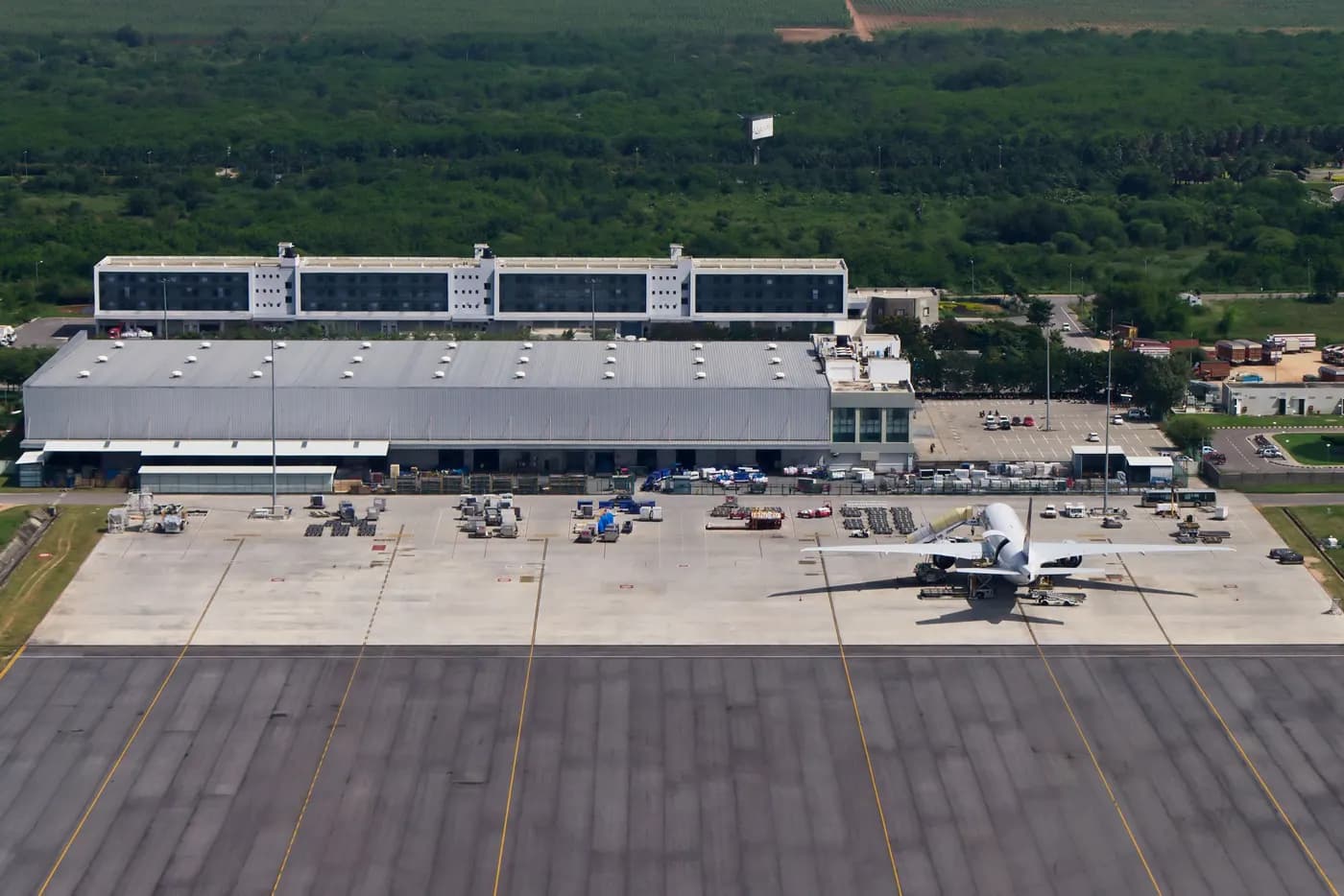 Aerial view of the air cargo terminal at Hyderabad airport with a freighter aircraft parked on the apron