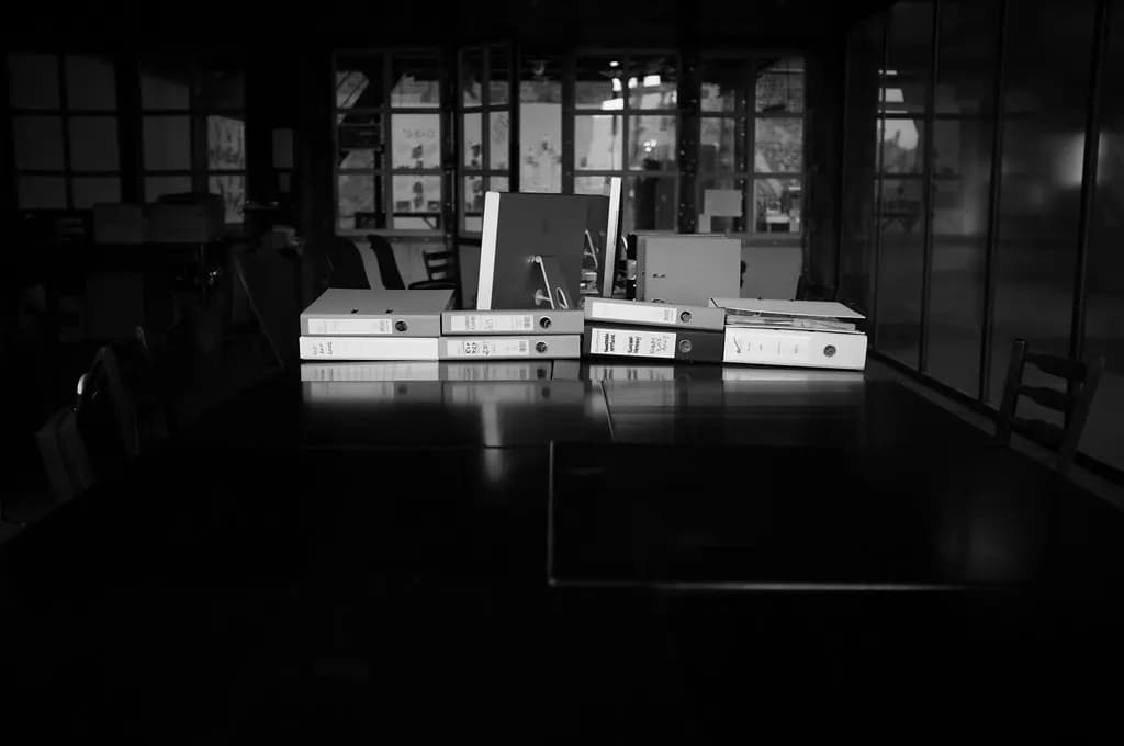 Lever arch files of accounting paperwork on a table in an office