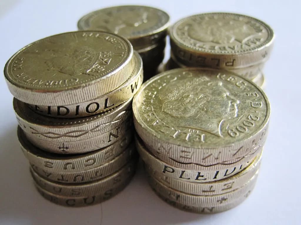 A pile of British pound coins