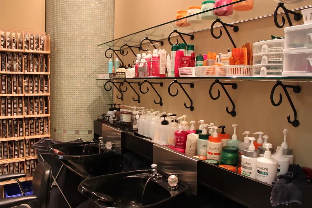 Hair salon wash basins with shelves of products