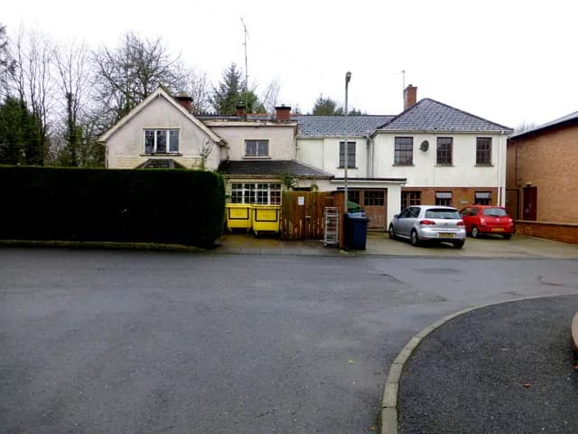 An old single-storey joinery workshop building with a corrugated roof in Omagh, County Tyrone