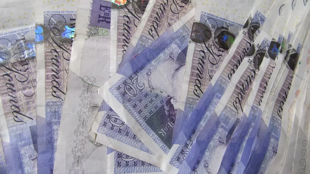 A fanned pile of Bank of England twenty pound notes