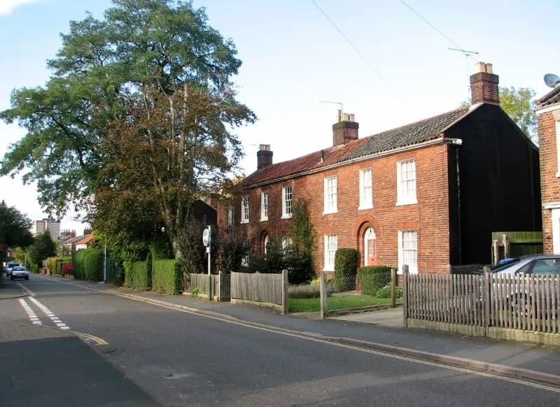 A row of brick terraced houses on Victoria Street, Norwich