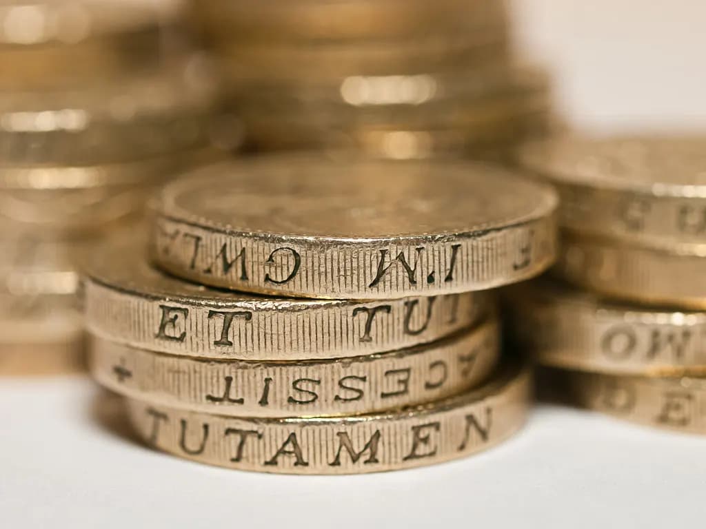 A pile of British one pound coins