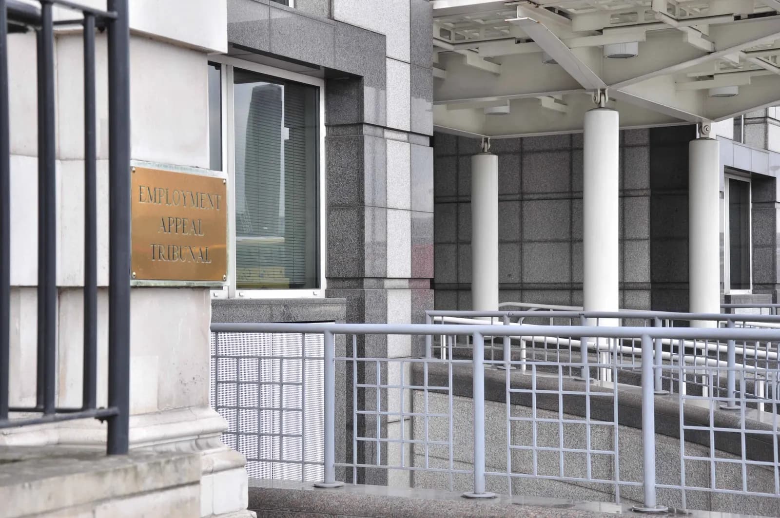 Brass plaque reading Employment Appeal Tribunal beside the entrance of its London building
