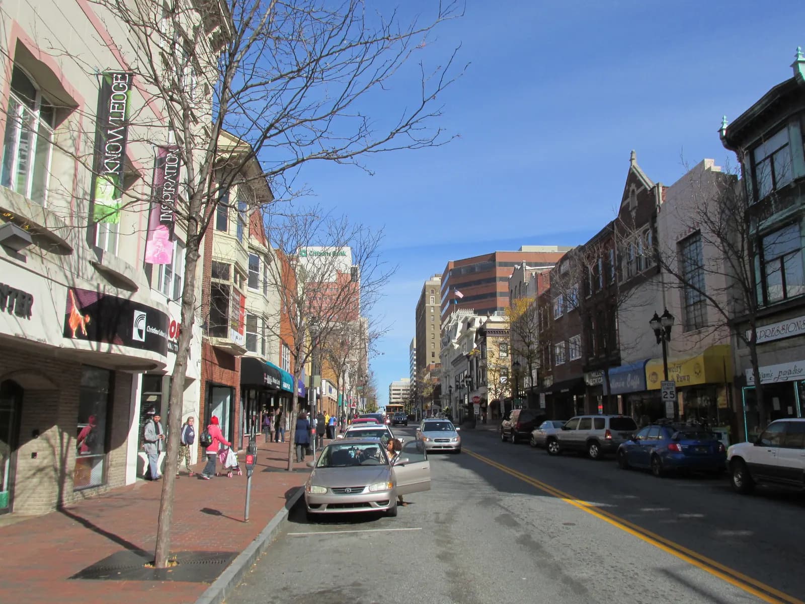 Market Street in downtown Wilmington, Delaware, with older shopfront buildings and office towers behind