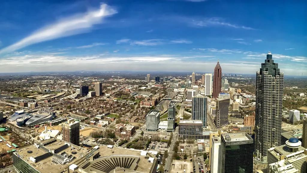 The downtown and Midtown Atlanta skyline under a blue sky