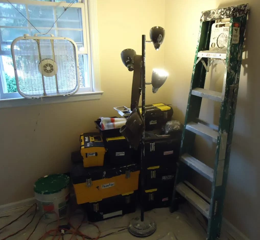 Hand tools and power tools sorted into boxes at a job site
