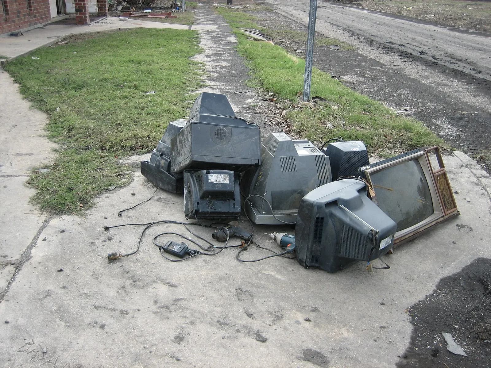 A pile of old tube televisions dumped on a curb in New Orleans