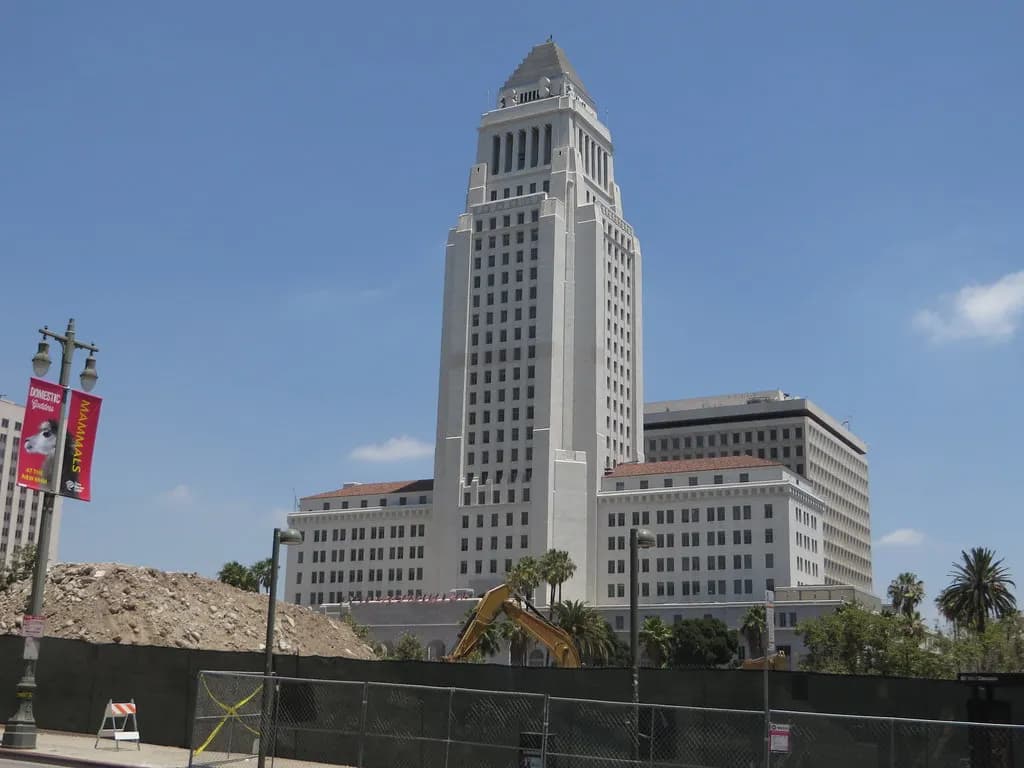 Los Angeles City Hall tower in downtown Los Angeles under a blue sky
